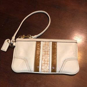 White and Brown Coach Wristlet